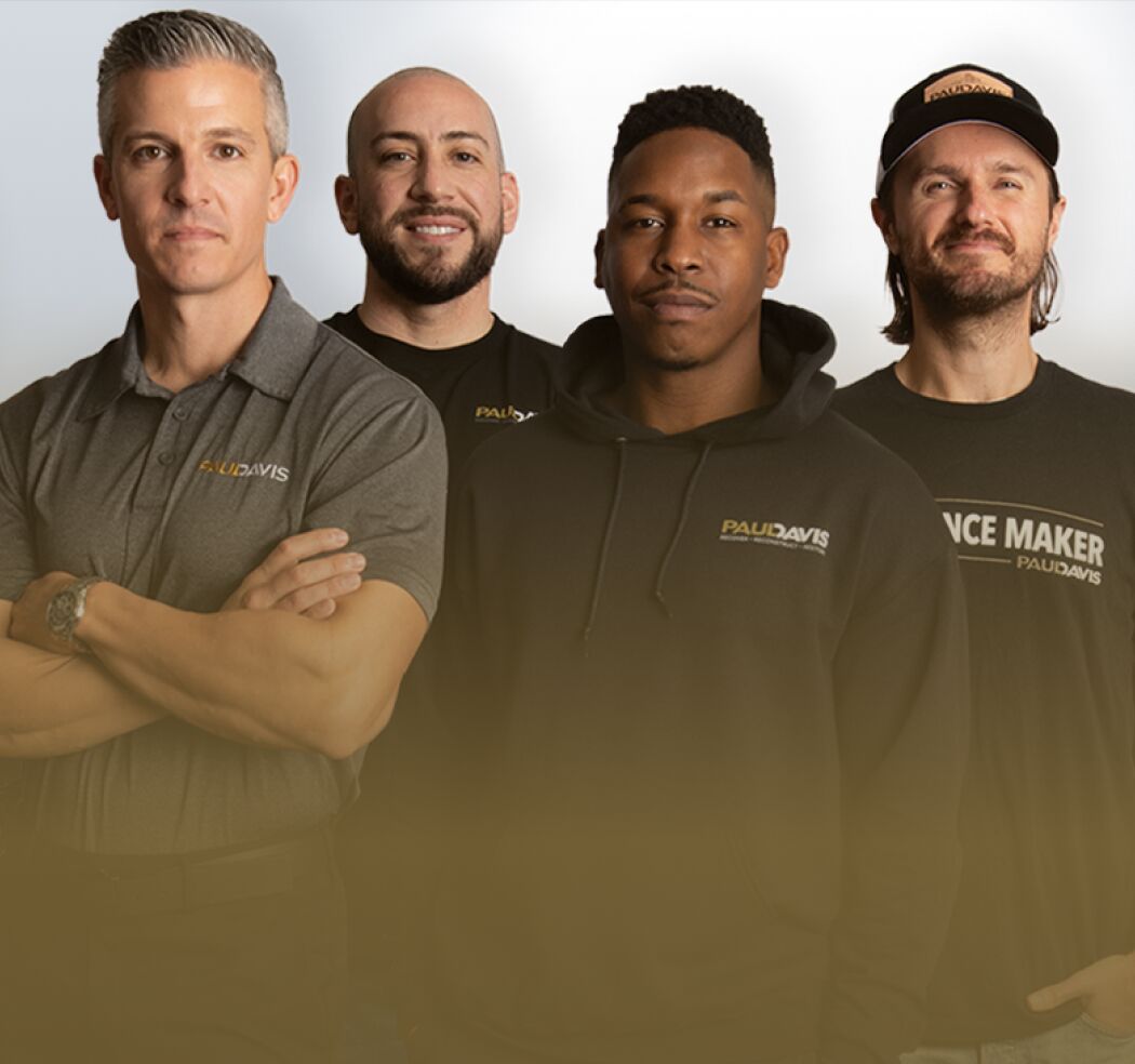 Paul Davis Restoration South Orange County team members standing together in branded workwear